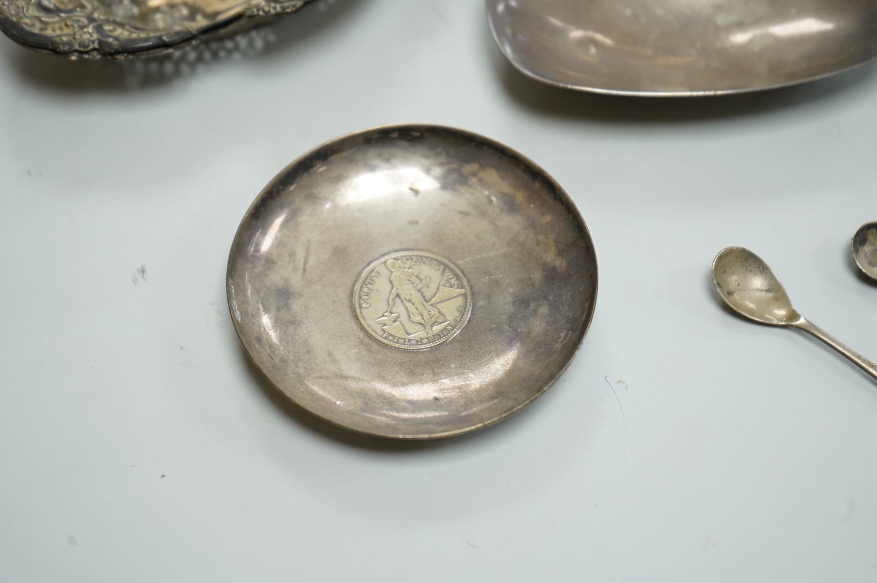 A collection of small silver, including a George III cream jug, London, 1762, 88mm, a George V sugar caster, small five bar toastrack, pair of bonbon dishes, pepperette, dish, two condiment spoons and mustard pot, togeth